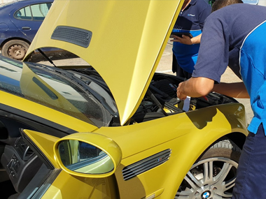 BMW M3 with ITV technicians